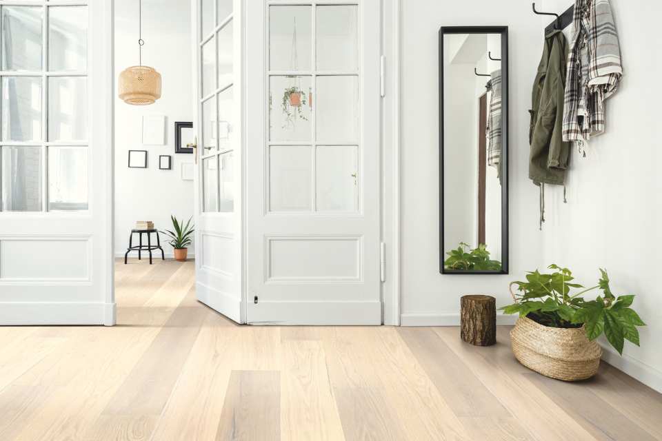 light white oak hardwood in entryway to modern home with green accents